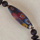 Venetian millifiori and black glass beads, 18